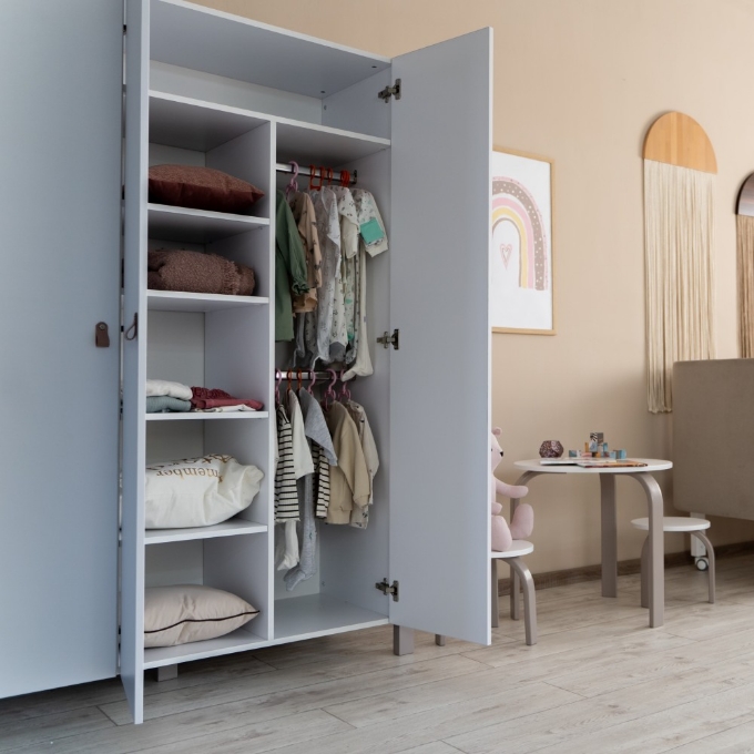 a white closet with clothes in it
